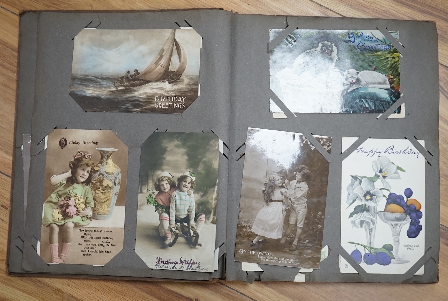 Two postcard albums, mostly topographical and other ephemera to include some black and white photographs. Condition - fair